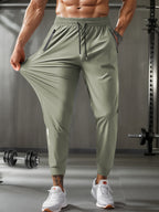 Mens Breathable Stretch Athletic Jogger Pants With Zipper Pockets